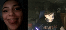 a girl is smiling next to a boy who is wearing a shirt that says ' marvel ' on it
