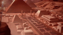 a model of a city with pyramids and buildings