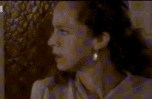 a blurry picture of a man and a woman with the letters tc on the bottom right