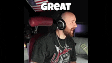 a man wearing headphones is sitting in a chair with the word mother written above him .