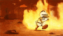 a cartoon character is running away from a fire in a desert .