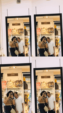 a couple taking a picture of themselves in front of a mirror with a sign that says ' aoyama ' on it