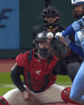 a baseball player wearing a blue jersey with the number 9 on it