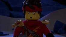 a lego character with a scarf around his neck holds a sword