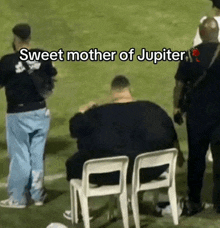 a man sits in a chair with the words sweet mother of jupiter written on the bottom