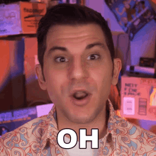 a man with a surprised look on his face has the word oh written on his face