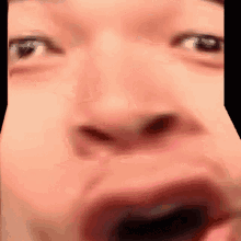 a close up of a person 's eyes and mouth