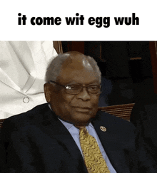 a man in a suit and tie with the words " it come wit egg wuh " below him