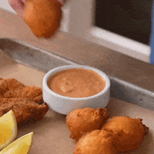 Dipping Fritters In The Sauce Brian Lagerstrom GIF - Dipping Fritters In The Sauce Brian Lagerstrom Putting Sauce In The Fritters GIFs