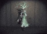 a woman in a white dress is standing in a dark forest