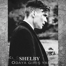 a black and white photo of a man with the name shelby written on the bottom