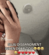 a person is covering their face with their hand and says ' suju disbandment when dear god '