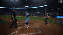 a baseball game is being played in a stadium with an ad for refreshing summer on the outfield wall