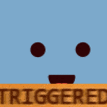 a cartoon face is sitting on top of a sign that says triggered .