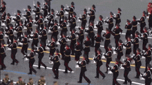 a large group of soldiers march in a line