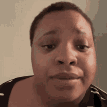 a close up of a woman 's face with a funny face .