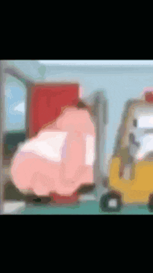a blurry picture of a cartoon character being pushed by a yellow forklift .