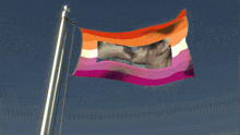 a lesbian flag with a picture of a couple kissing on it