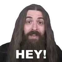 a man with long hair and a beard is saying " hey "