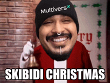 a man in a santa suit is holding a bell and the caption skibidi christmas