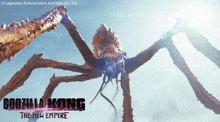 a poster for godzilla kong the new empire shows a giant spider