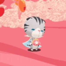 a cartoon cat wearing a cape and holding a heart is standing on a pink surface .