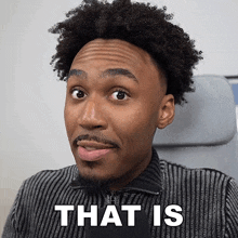 a man with curly hair and a beard is making a funny face with the words that is behind him