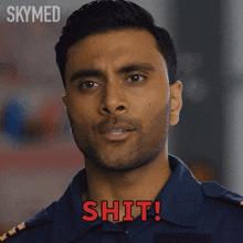 a close up of a man 's face with the word skymed behind him
