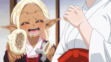 a girl with blonde hair and ears is holding a piece of food with her mouth open