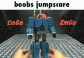 a blue robot with the words boobs jumpscare on the bottom