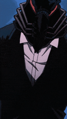 a man in a tuxedo with a mask on his head