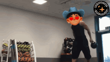 a man in a cowboy hat is holding a dumbbell in a gym with a logo for introverts smarts