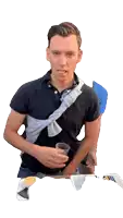 a man wearing a black polo shirt is holding a cup