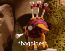 a stuffed animal with golf tees on its head says * bagpipes*