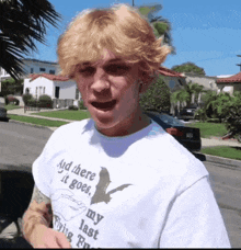 a man wearing a t-shirt that says " and there it goes my last flying trip "