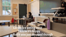 a woman sits at a desk in a classroom with the words condo is a voting issue