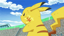 a pikachu is holding a lightning bolt in its mouth while standing in front of a crowd in a stadium .