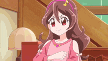 a girl with brown hair and a pink headband