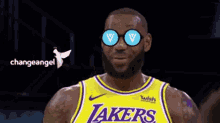 a basketball player wearing a lakers jersey and sunglasses