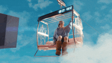 a person is sitting in a ferris wheel with a sign that says ' 좋은 아름 ' on it