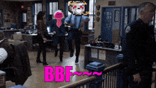 a group of people are dancing in a room with the words bbf written in pink