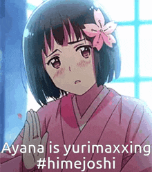 a girl with a flower in her hair is wearing a pink kimono and giving the middle finger .