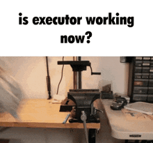 a picture of a vise on a workbench with the words " is executor working now "