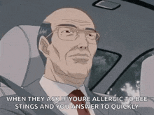 a man in a suit and tie is driving a car and says when they ask if youre allergic to bees