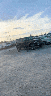 a jeep is parked in a parking lot next to other cars