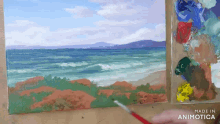 a painting of a beach is being made by animatica