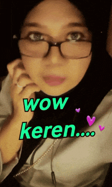 a woman wearing glasses and a hijab with the words wow keren