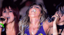 a woman singing into a microphone with the word anahioverdose on the bottom right