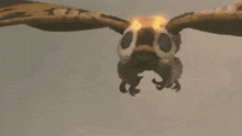 a dragon is flying through the air with a lot of fire coming out of its wings .