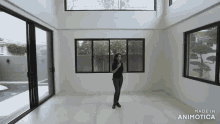 a woman is standing in an empty room with lots of windows made in animotica